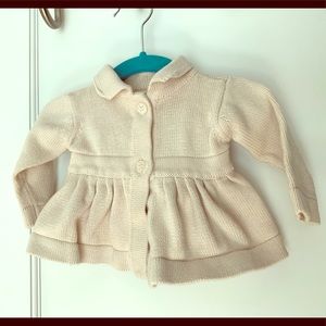 Adorable peplum baby sweater